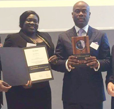 From right: MD/CEO Access Bank Herbert Wigwe and Head Sustainability, Omobolanle Victor-Laniyan receiving the award during the ceremony