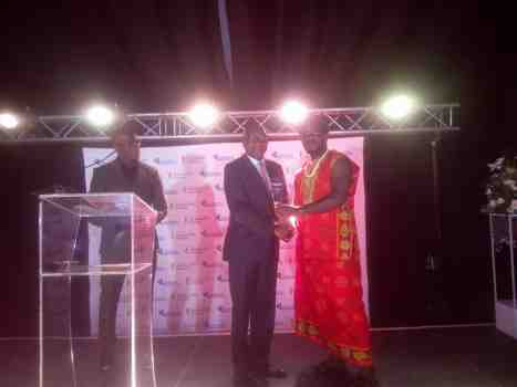 Odimegwu Onwumere receiving the award from the Director-CEO of Continental Reinsurance PLC Dr Femi Oyetunji