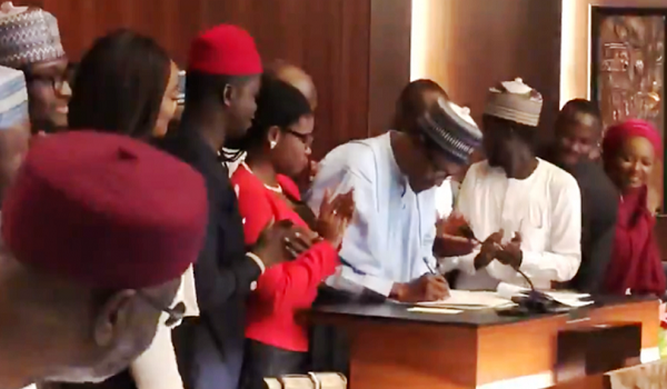 Image result for buhari signing not too young to run bill