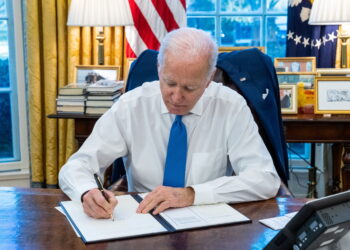 U.S. President Joe Biden signs an executive order, in Washington