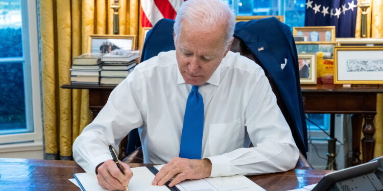 U.S. President Joe Biden signs an executive order, in Washington