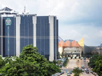 Central Bank of Nigeria headquarters in Abuja with the Nigerian National Mosque visible in the background